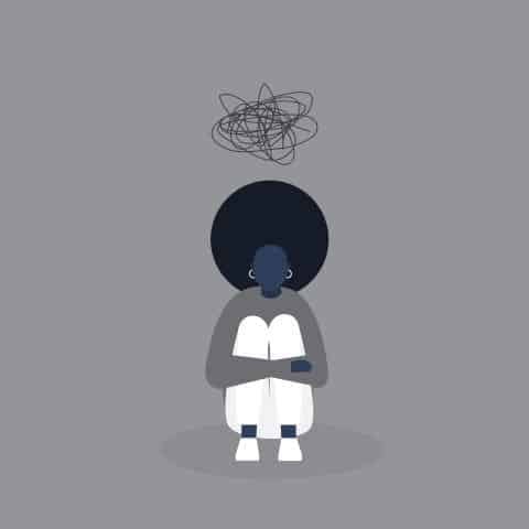 Young character worried, holding knees, sat on floor with grey background, overthinking.