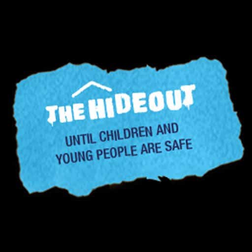 The hideout logo text in white with subtitle "until children and young people are safe" below, on a blue scrap of paper, against black background