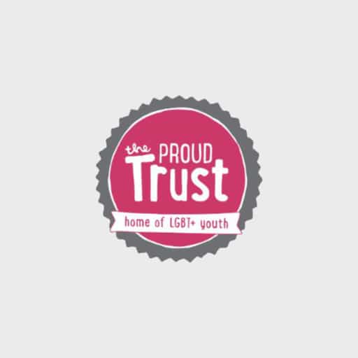 Grey, pink and white Proud trust circular logo against light grey background